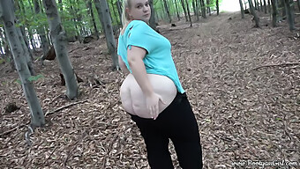 A Voluptuous Young Woman With Attractive Curves Pleasures And Engages In Sexual Activity With Her Boyfriend In A Wooded Area