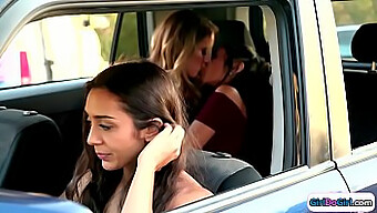 Lilly Hall And Gianna Dior Engage In Passionate Kissing In The Rear Compartment Of A Vehicle, Observed By An Unknown Driver