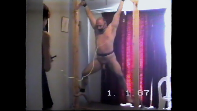 Shows a submissive partner being dominated and punished with a whip